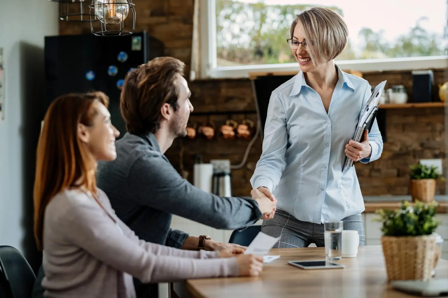 three people at a business meeting